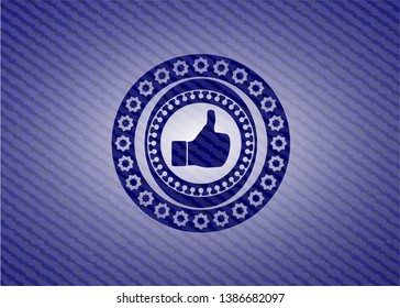like icon inside badge with denim background