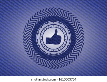 like icon inside badge with denim background