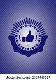 like icon inside badge with denim texture. 