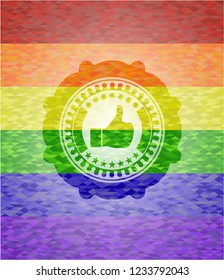 like icon inside emblem on mosaic background with the colors of the LGBT flag