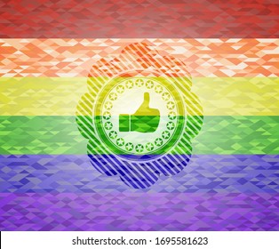 like icon inside emblem on mosaic background with the colors of the LGBT flag