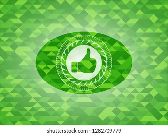 like icon inside green mosaic emblem