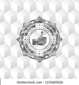 like icon inside grey badge with geometric cube white background