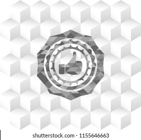 like icon inside grey emblem with cube white background