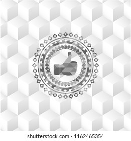 like icon inside grey emblem with geometric cube white background