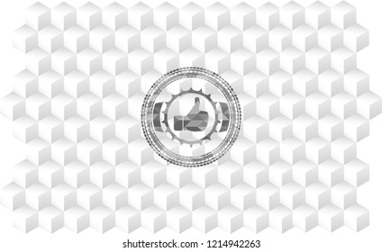 like icon inside grey emblem with geometric cube white background
