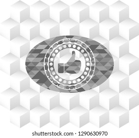 like icon inside grey emblem with geometric cube white background