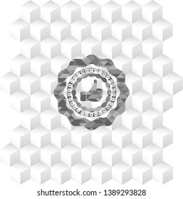 like icon inside grey emblem with geometric cube white background