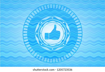 like icon inside light blue water wave style emblem.