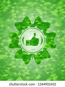 like icon inside realistic green emblem. Mosaic background