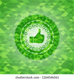 like icon inside realistic green emblem. Mosaic background