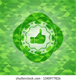 like icon inside realistic green emblem. Mosaic background