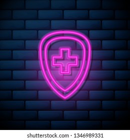 Lilac pink neon sign on brick wall Healthcare concept. Protected symbol