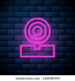 Lilac pink neon sign on brick wall Medical Uniform icon. Healthcare symbol