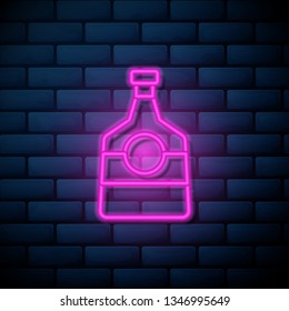 Lilac pink neon sign on brick wall Alcohol bottle icon. Bar concept