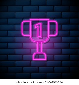 Lilac pink neon sign on brick wall Champion cup for winner. Championship trophy. Victory concept