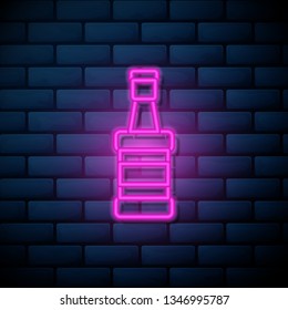 Lilac pink neon sign on brick wall Whiskey bottle. Alcohol concept