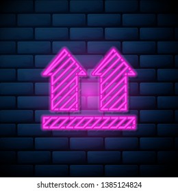 Lilac pink neon sign on brick wall Delivered mark icon. Trendy Delivered logo