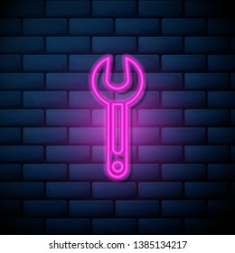 Lilac pink neon sign on brick wall Repair icon. Wrench icon