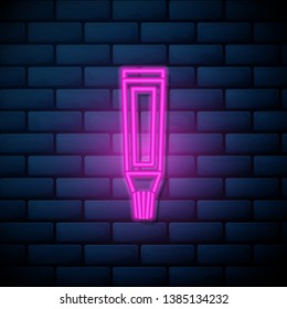 Lilac pink neon sign on brick wall Toothpaste, cream tube.