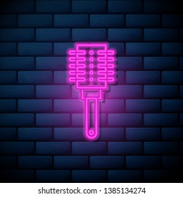 Lilac pink neon sign on brick wall Brush and hair symbol. Hairbrush collection