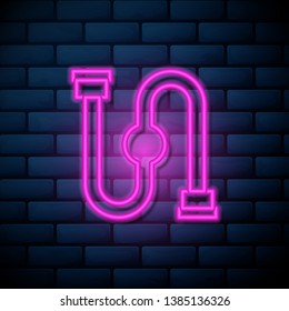 Lilac pink neon sign on brick wall Trumpet icon. One of Construction Material