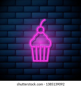 Lilac pink neon sign on brick wall Cup cake icon. Dessert symbol