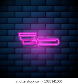 Lilac pink neon sign on brick wall Filter holder with ground coffee. Portafilter symbol