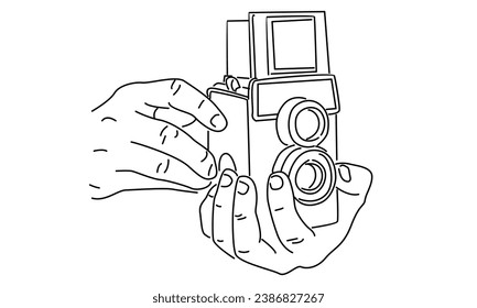 line art of hand holding photo camera