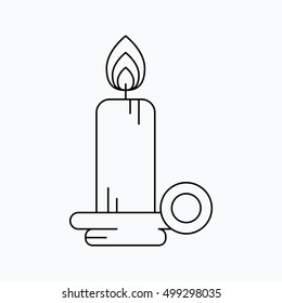 Line burning candle with a holder. Vector illustration. Vector icon