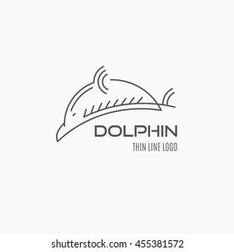 Line style nautical logo - jumping dolphin vector illustration. Minimalistic outlined emblem. Elegant sea mammal design.