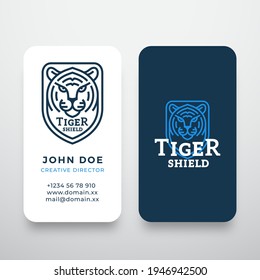 Line Style Tiger Face Shield Abstract Vector Logo and Business Card Template. Wild Animal Head Sillhouette Incorporated in a Shield Frame. Premium Stationary Realistic Mock Up. Isolated.