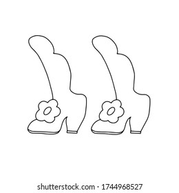 Linear black and white hand drawn in doodle style cartoon vector illustration of witch's shoes, simple drawing for autumn holidays celebration design
