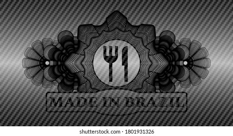 Linear currency decoration knife and fork icon and Made in Brazil text carbon fiber badge. Polymer texture fancy background. Intense illustration. 