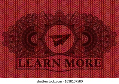 Linear decoration paper plane icon and Learn more text Red color woolen fabric badge. Cloth chic background. Illustration. 