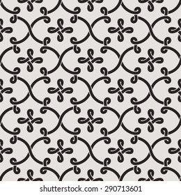 Linear seamless pattern.  Decorative lattice in the Moroccan style with scrolls, knots and loops on gray background. Vector illustration.