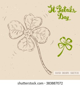 Linear sketch of the irish lucky four-leaf clover and text congratulation St. Patrick's Day. Vector vintage hand drawn illustration on the textured paper background.