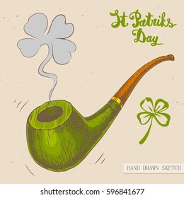 Linear sketch of the tobacco pipe with fume and text St. Patrick's Day. Vector vintage hand drawn illustration on the textured paper background.