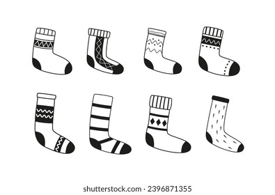 Linear winter knitted socks and stockings. Warm foot wear. Cold season essentials. Outline doodles. Line art. Christmas time, New Year. 