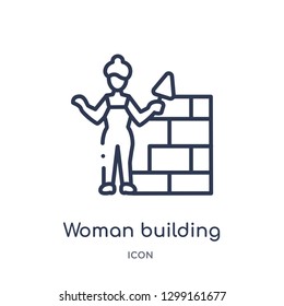 Linear woman building a wall icon from Ladies outline collection. Thin line woman building a wall icon isolated on white background. woman building a wall trendy illustration