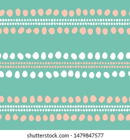 Lines of abstract spots and shapes summer seamless vector pattern. Elegant modern tribal stripe design. Boho beads, pom-poms and dots in pink and white on green background repeating pattern.