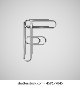 Linked paperclips forming letter F, vector