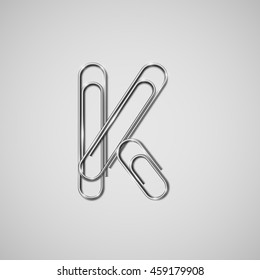 Linked paperclips forming letter K, vector