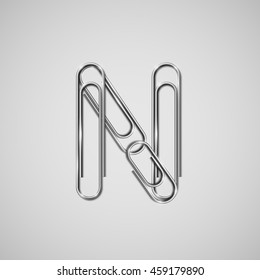 Linked paperclips forming letter N, vector
