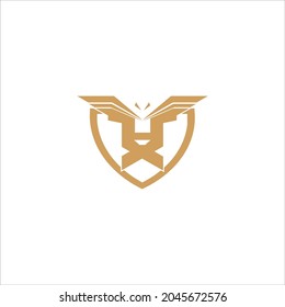 Lion and eagle logo in gold on white background