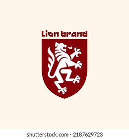 Lion on shield heraldic emblem. Logo design template. Vector illustration.