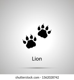 Lion paws, steps imprints, simple black silhouette on gray