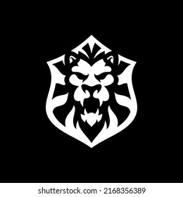 Lion shield emblem logo design. Lion head or face and shield vector illustration on dark background