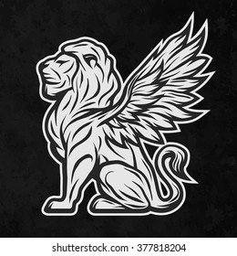 Lion statue with wings on a dark background.
