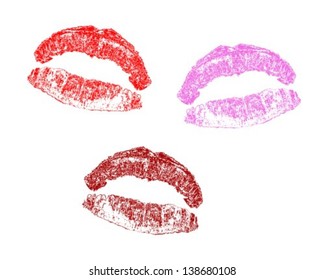 Lip print in three different colors on a white background